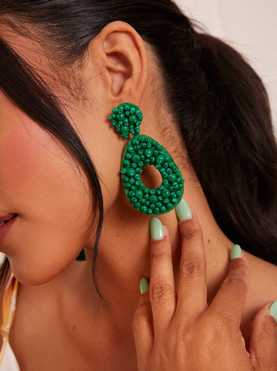 Statement Beaded Oval Earrings in Green sold by Chi Chi London
