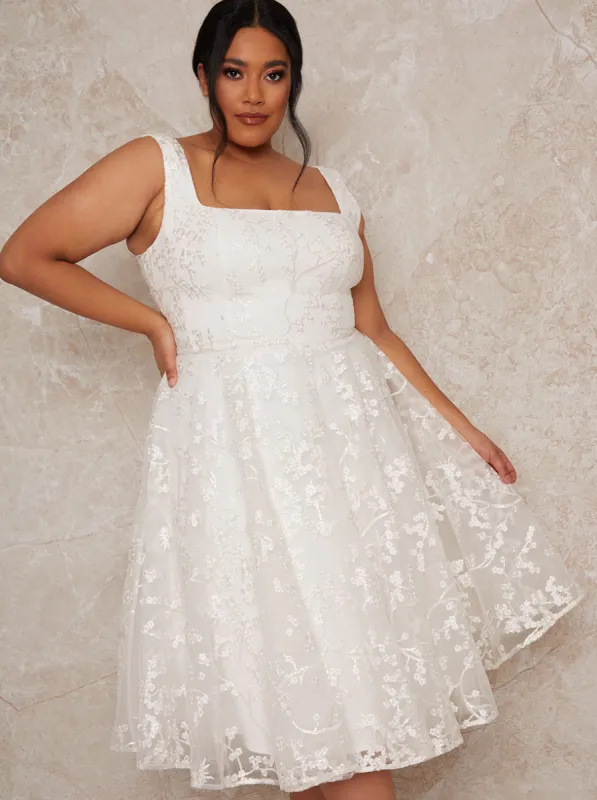 Plus Size Sleeveless Lace Midi Wedding Dress in White sold by Chi Chi London