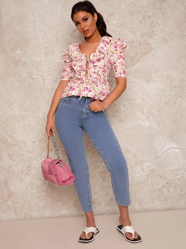 Floral Print Ruffle V Neck Blouse in White sold by Chi Chi London