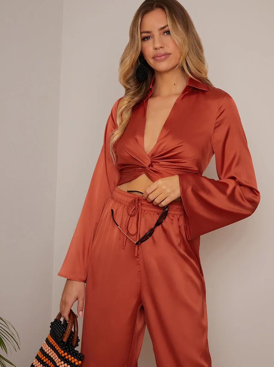 Long Sleeve V Neck Satin Twist Detail Top in Burnt Orange sold by Chi Chi London product image thumbnail 2