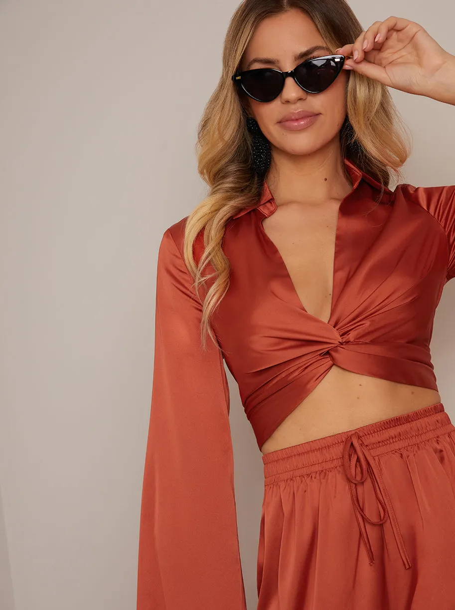 Long Sleeve V Neck Satin Twist Detail Top in Burnt Orange sold by Chi Chi London product image thumbnail 3