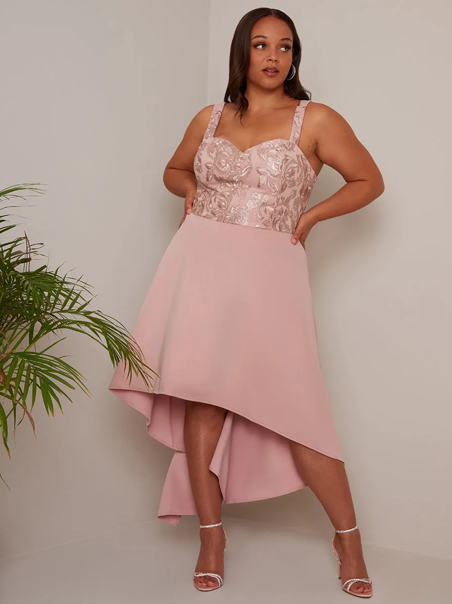 Plus Size Embroidered Dip Hem Dress in Pink sold by Chi Chi London