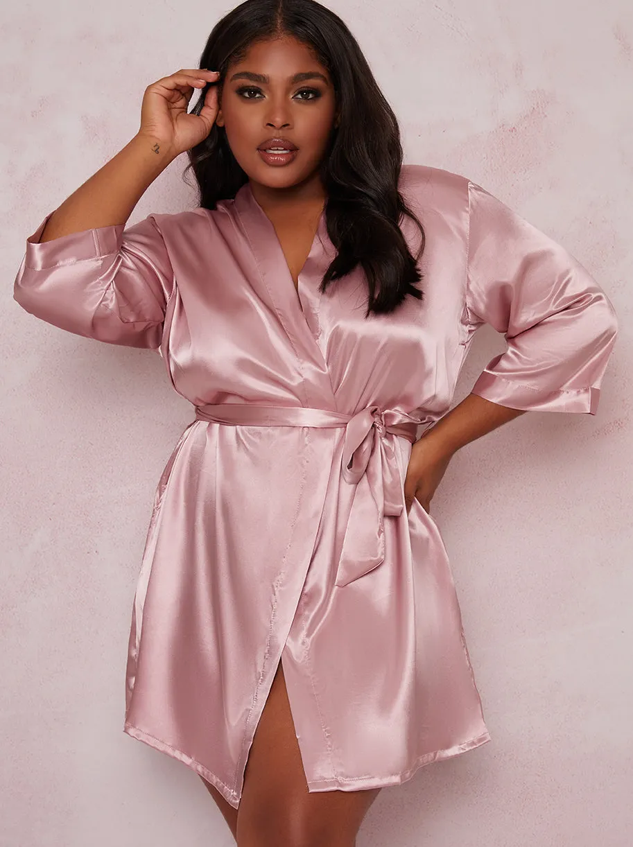 Plus Size Tie Waist Satin Look Robe in Pink sold by Chi Chi London