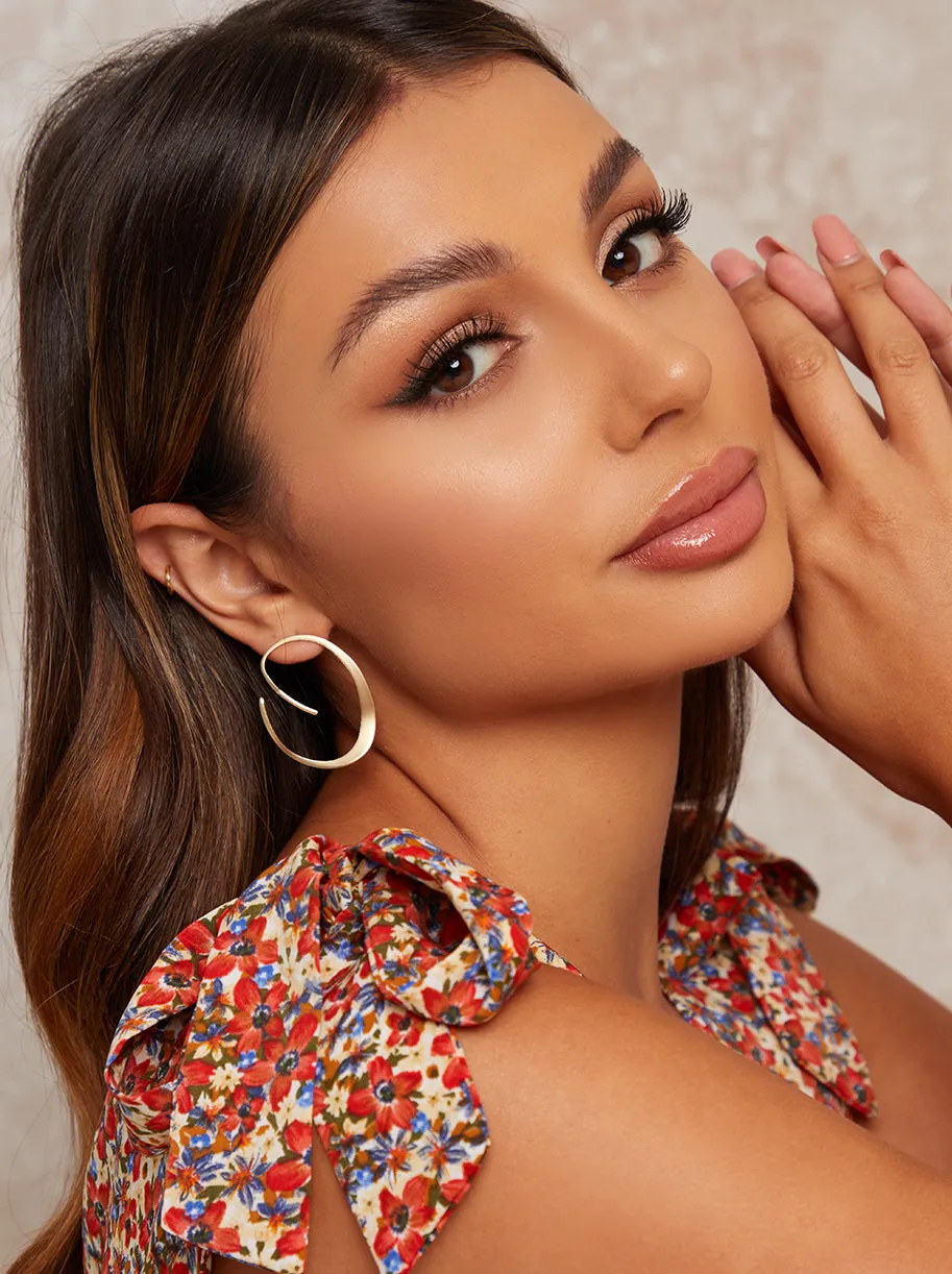 Hoop Spiral Design Earrings in Gold Tone sold by Chi Chi London