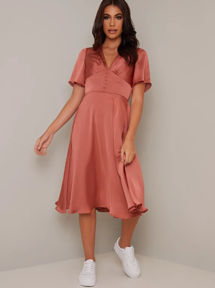 Ruffle Hem Cap Sleeve Silky Midi Dress in Orange sold by Chi Chi London