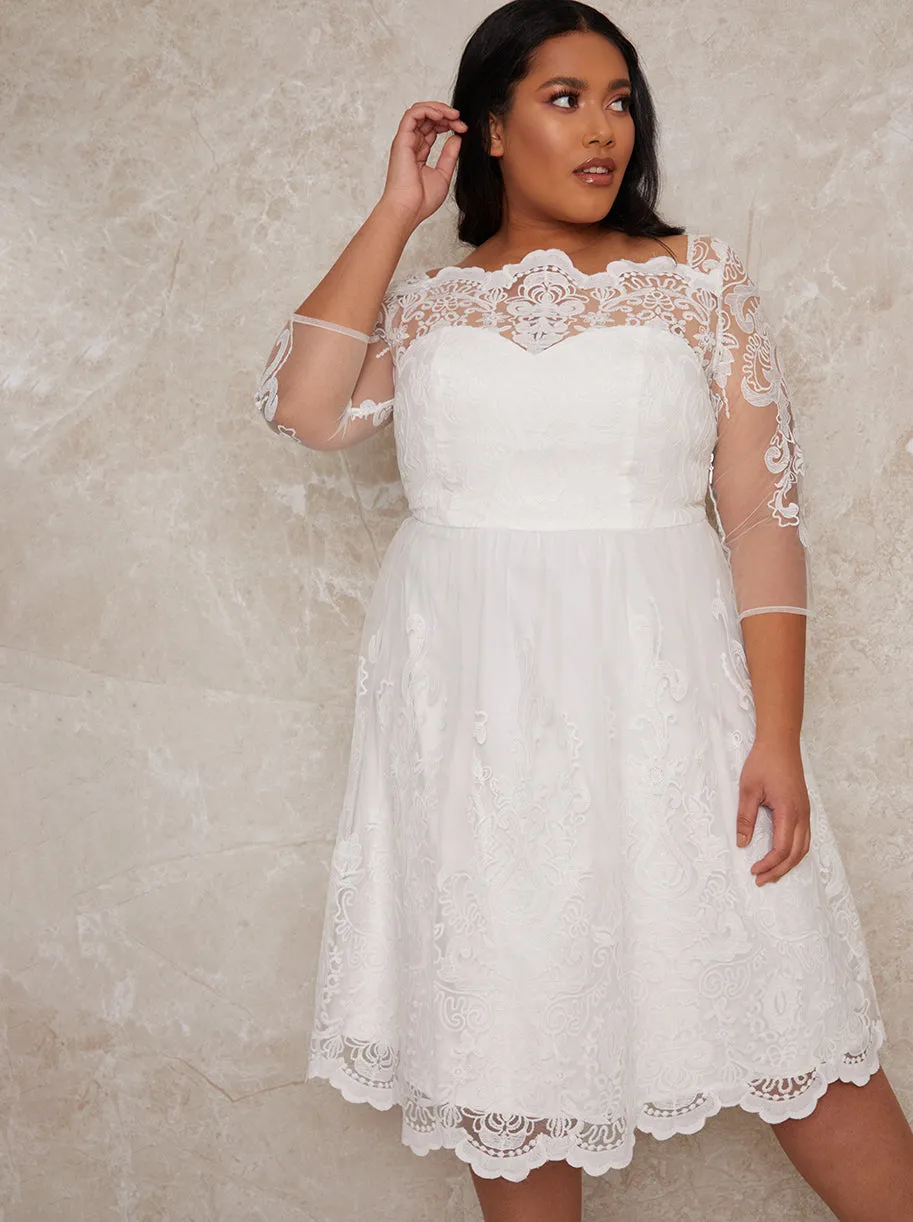 Plus Size Lace Long Sleeve Midi Wedding Dress in White sold by Chi Chi London