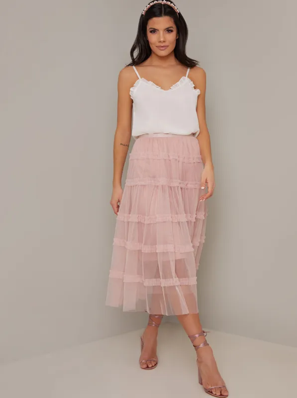 Mesh Overlay Tiered Midi Skirt in Pink sold by Chi Chi London