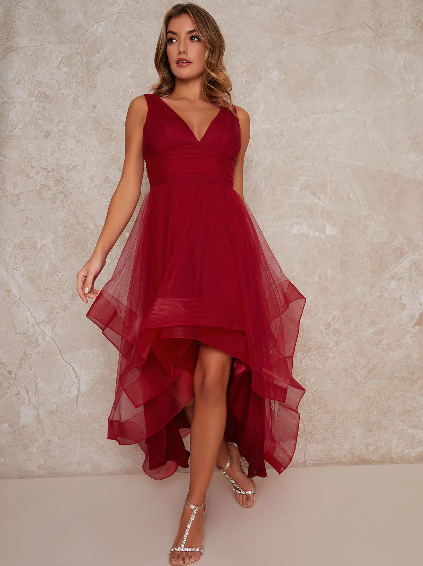 Plunge Neck Tiered Tulle Dip Hem Party Dress in Red sold by Chi Chi London