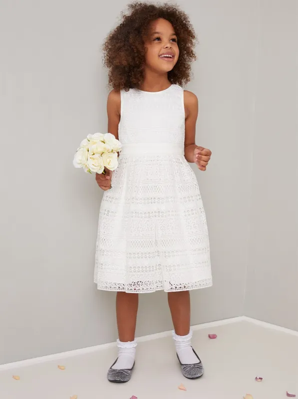Girls Crochet Ribbon Band Dress in White sold by Chi Chi London