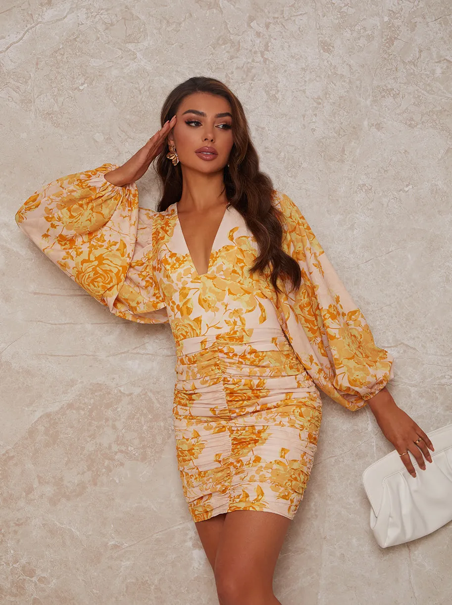 Ruched Long Sleeve Floral Print Mini Dress in Yellow sold by Chi Chi London