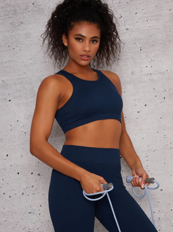 Ribbed Cropped Sports Bra in Navy sold by Chi Chi London
