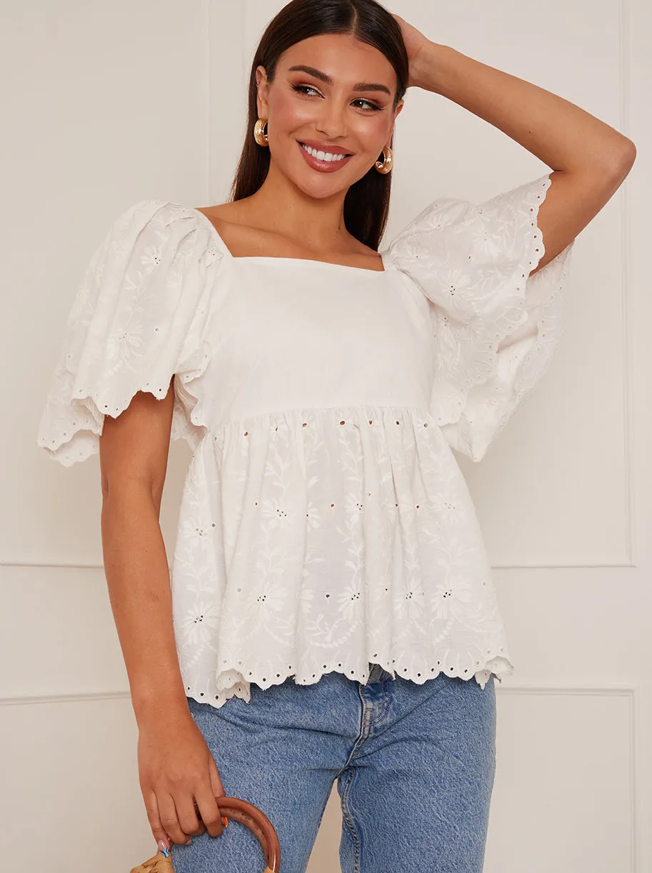 Short Sleeve Broderie Anglaise Peplum Top in White sold by Chi Chi London