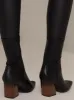 Ankle Zip Boots with Block Heel in Black sold by Chi Chi London