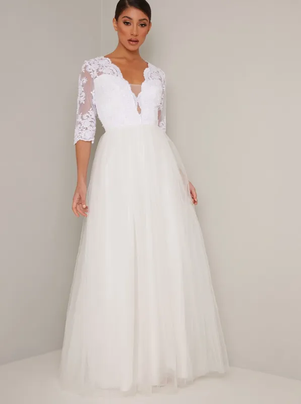 Bridal Sheer Sleeved Embroidered Wedding Dress in White sold by Chi Chi London