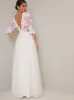 Bridal Sheer Sleeved Embroidered Wedding Dress in White sold by Chi Chi London