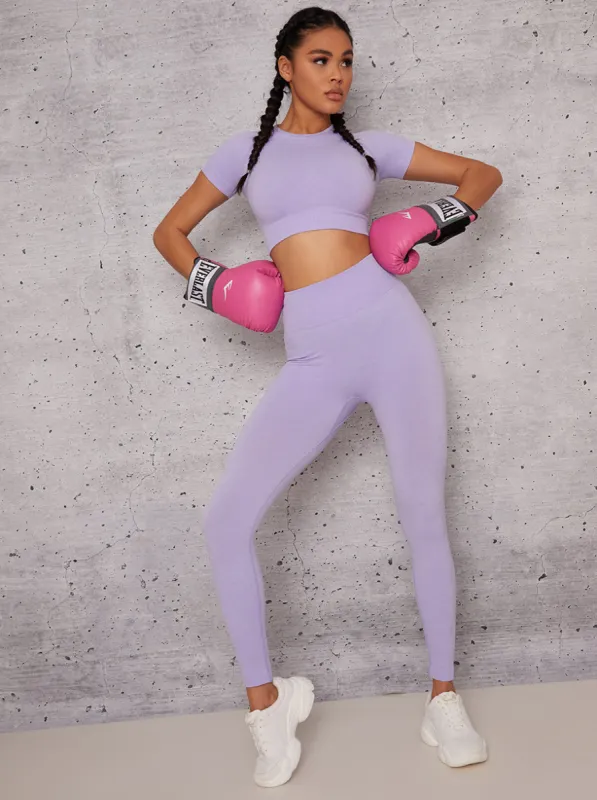 Mid Rise Sports Leggings in Purple sold by Chi Chi London