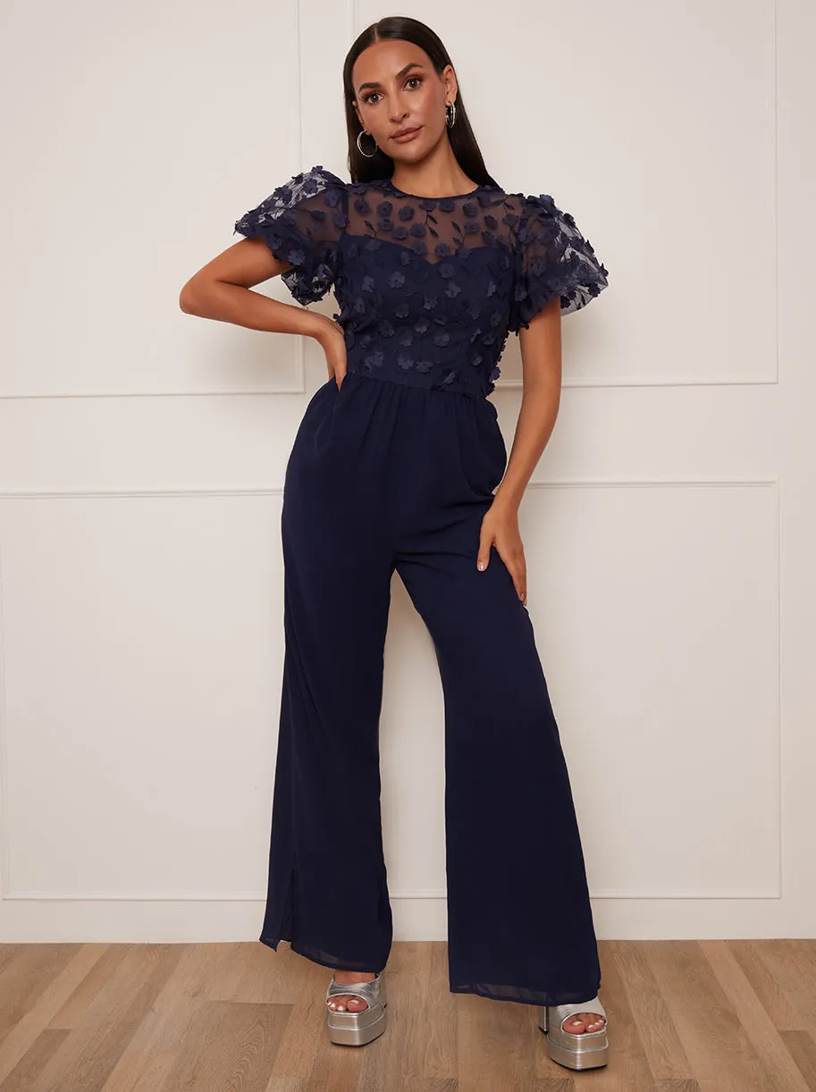 Petite Flutter Sleeve Lace Wide Leg Jumpsuit in Navy sold by Chi Chi London