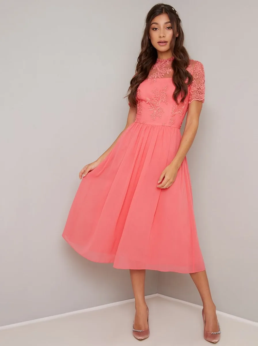 Embroidered Short Sleeved Midi Dress in Coral sold by Chi Chi London