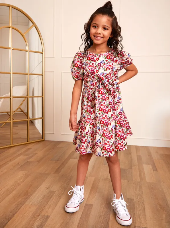 Younger Girls Puff Sleeve Tie Detail Floral Dress in White sold by Chi Chi London