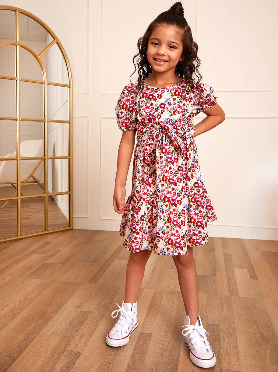 Younger Girls Puff Sleeve Tie Detail Floral Dress in White sold by Chi Chi London