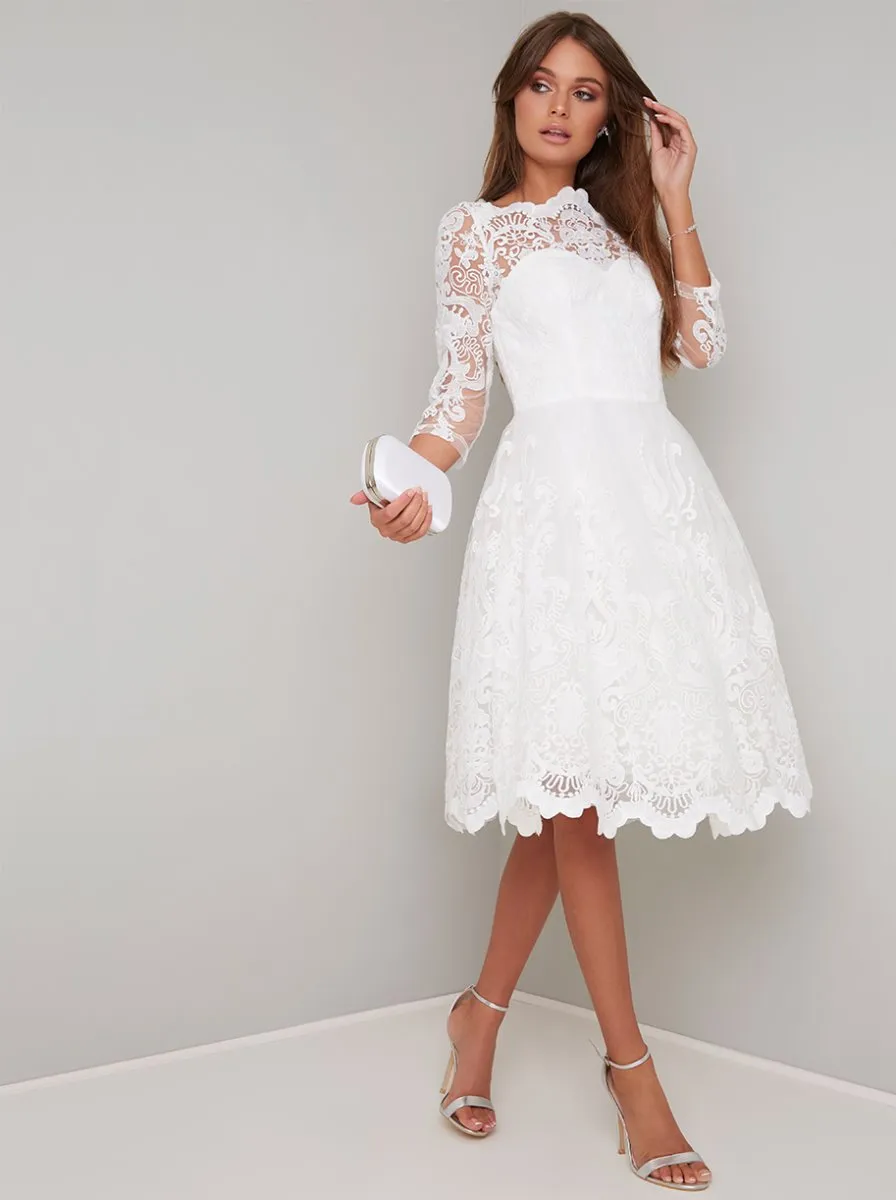 Lace Embroidered Long Sleeve Tulle Midi Dress in White sold by Chi Chi London
