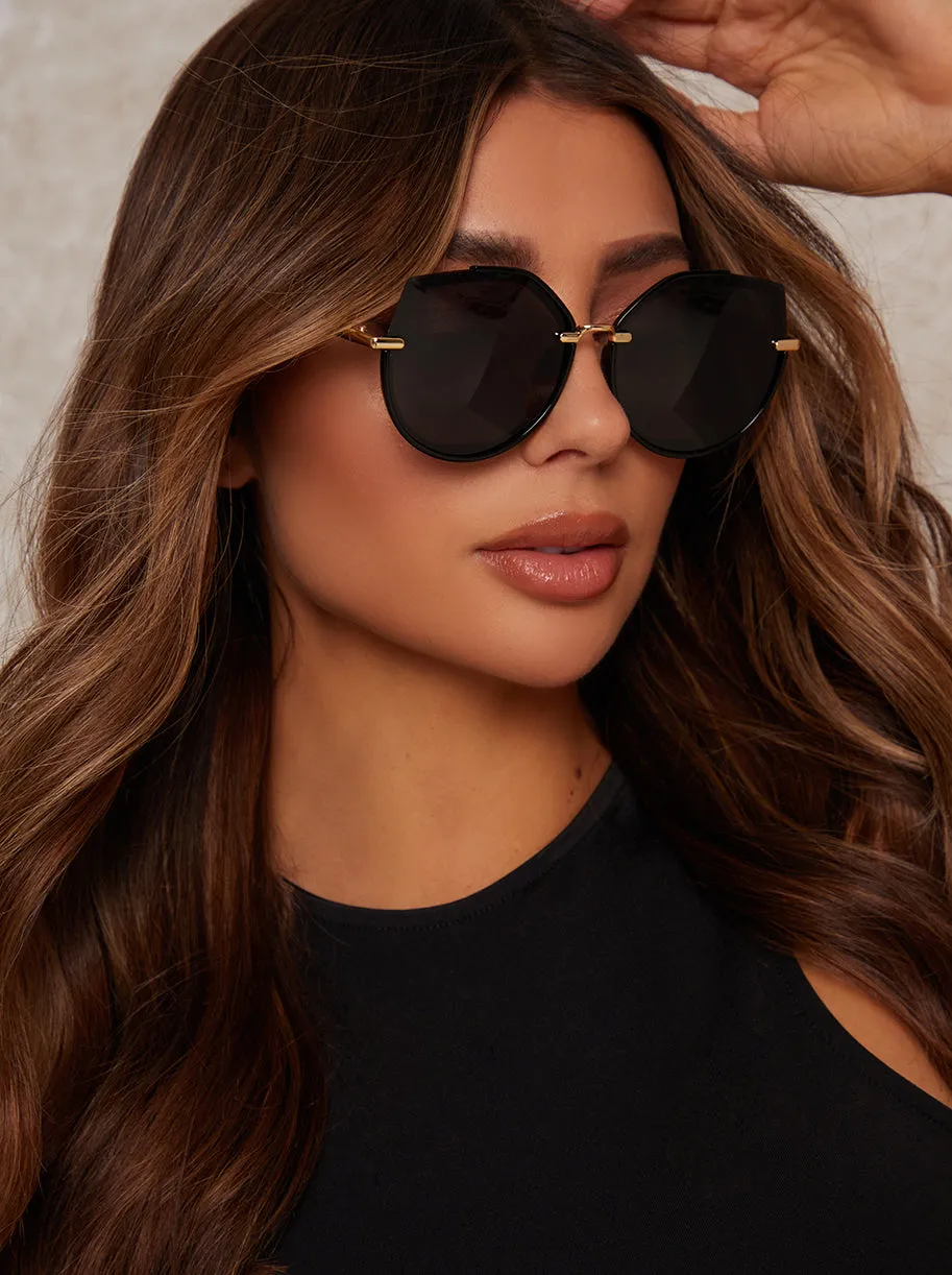 Oversized Rounded Cat Eye Sunglasses in Black sold by Chi Chi London