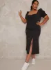 Plus Size Polka Dot Puff Sleeve Midi Dress in Black sold by Chi Chi London