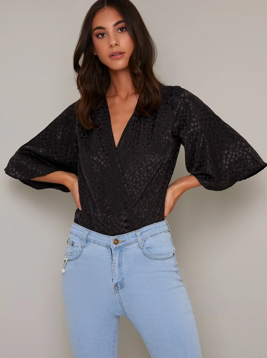 Wrap Style Flared Sleeved Bodysuit in Black sold by Chi Chi London