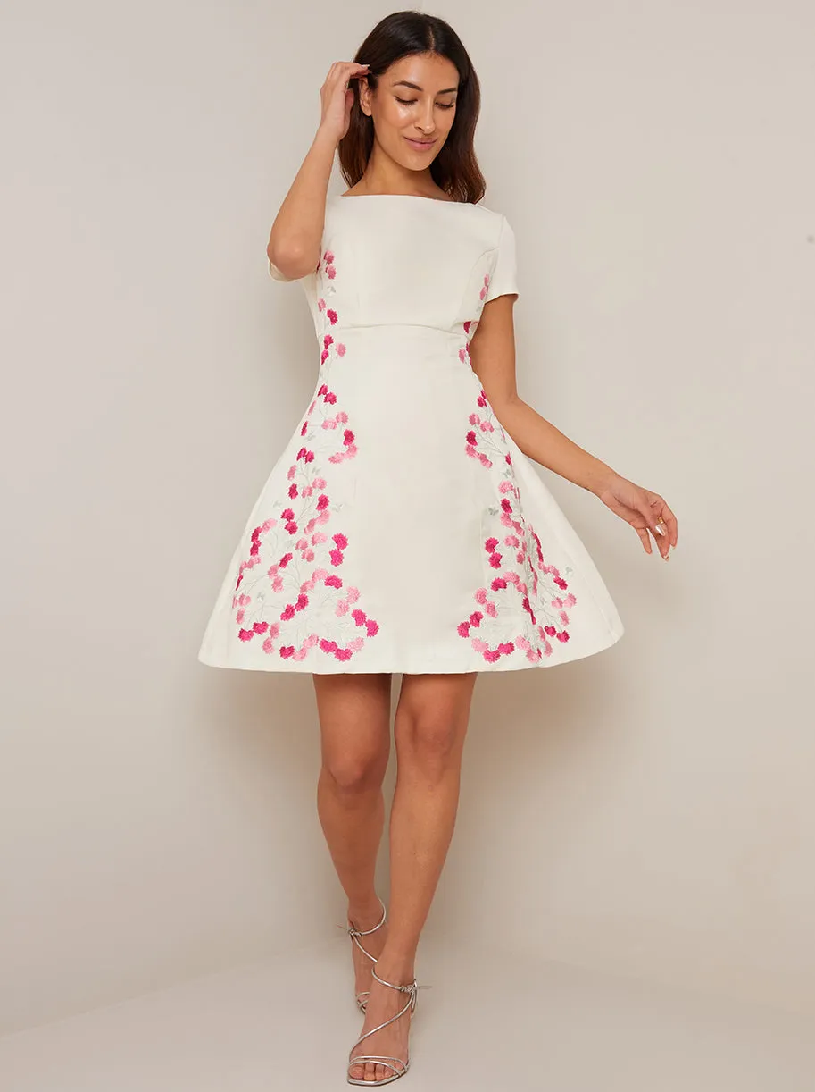 Floral Embroidered Skater Midi Dress in Cream sold by Chi Chi London
