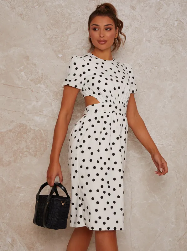 Polka Dot Open Back Puff Sleeve Midi Dress in White sold by Chi Chi London