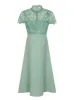 Petite Crochet Bodice High Neck Skater Dress in Green sold by Chi Chi London