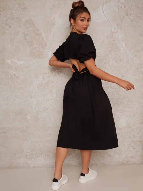 Open Back Puff Sleeve Midi Smock Dress in Black sold by Chi Chi London
