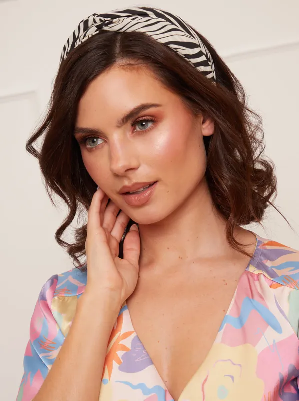 Zebra Print Knot Detail Headband in Mono sold by Chi Chi London