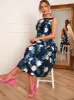 Boat Neck Floral Print Skater Dress in Navy sold by Chi Chi London