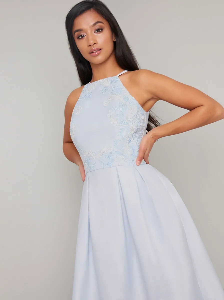 Petite Embroidered Bodice Dip Hem Midi Dress in Blue sold by Chi Chi London