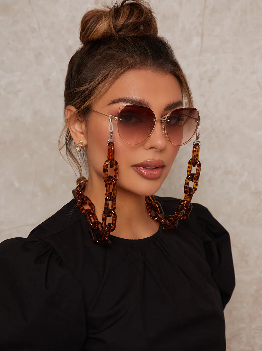 Chunky Tortoiseshell Sunglasses Chain in Brown sold by Chi Chi London