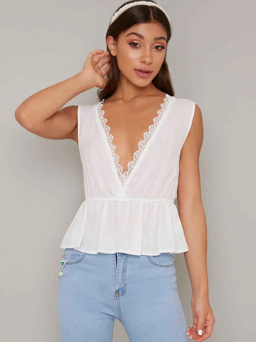 Lace Edged Peplum Top in White sold by Chi Chi London