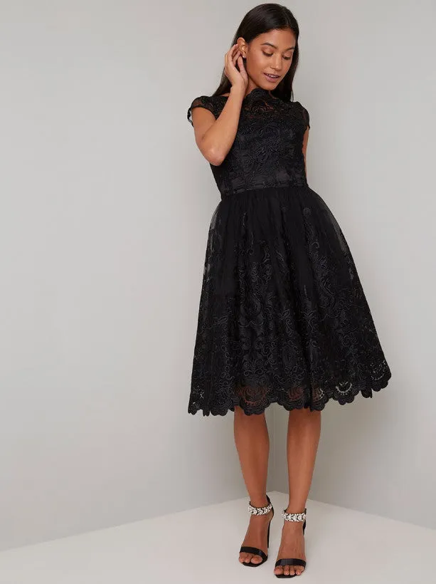 Lace Overlay Cap Sleeve Midi Dress in Black sold by Chi Chi London