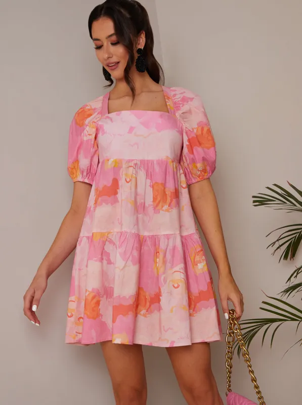 Puff Sleeve Washed Floral Mini Dress in Pink sold by Chi Chi London
