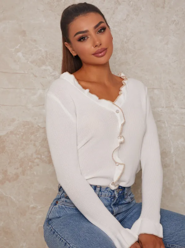 Ruffle Trim Cardigan in Cream sold by Chi Chi London
