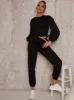 Ruched Detail Sweatshirt & Jogger Loungewear Set in Black sold by Chi Chi London