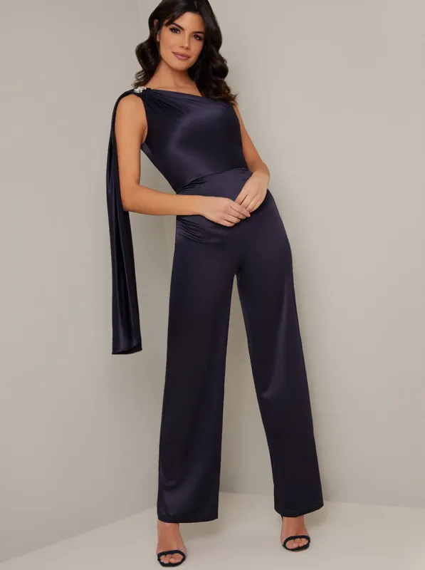 Draped Shoulder Straight Leg Silky Jumpsuit in Blue sold by Chi Chi London