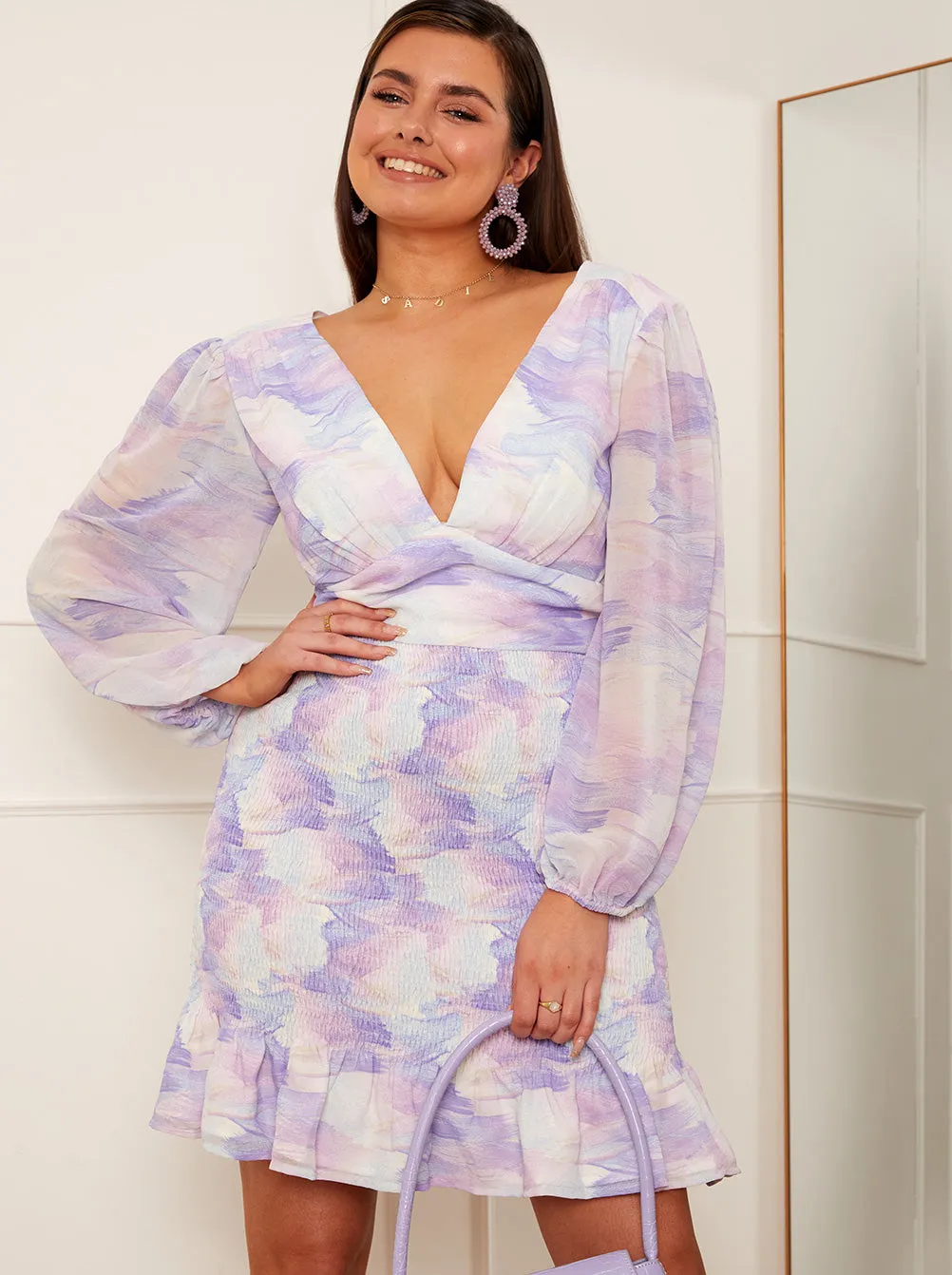 Long Sleeve Shirred Washed Print Mini Dress in Lilac sold by Chi Chi London