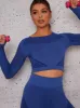 Long Sleeved Cropped Sports Top in Blue sold by Chi Chi London