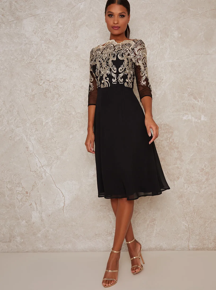 Metallic Lace Sheer Sleeved Midi Dress In Black sold by Chi Chi London