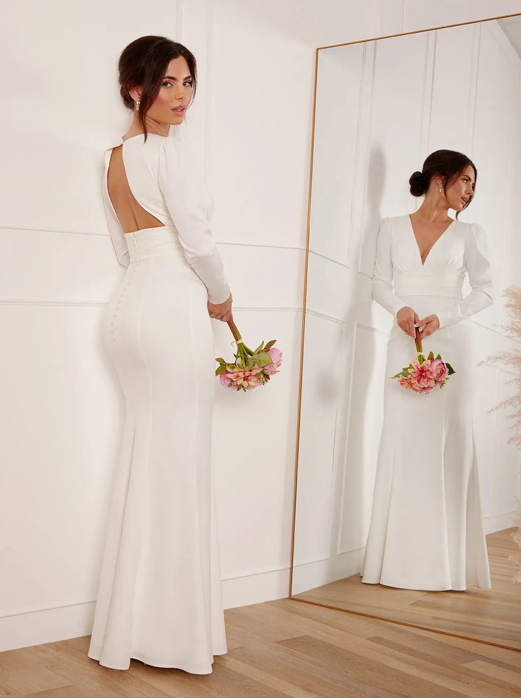 Petite Long Sleeve Plunge Open Back Wedding Dress in White sold by Chi Chi London