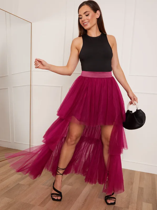Petite Tiered Tulle Dip Hem Skirt in Purple sold by Chi Chi London
