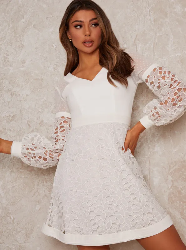 Crochet Mini Dress in White sold by Chi Chi London