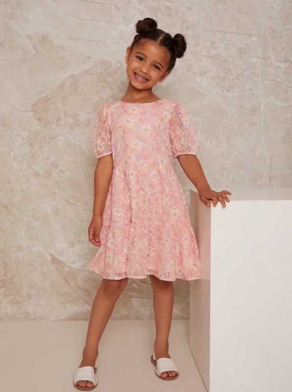 Girls Puff Sleeve Textured Floral Print Dress in Pink sold by Chi Chi London