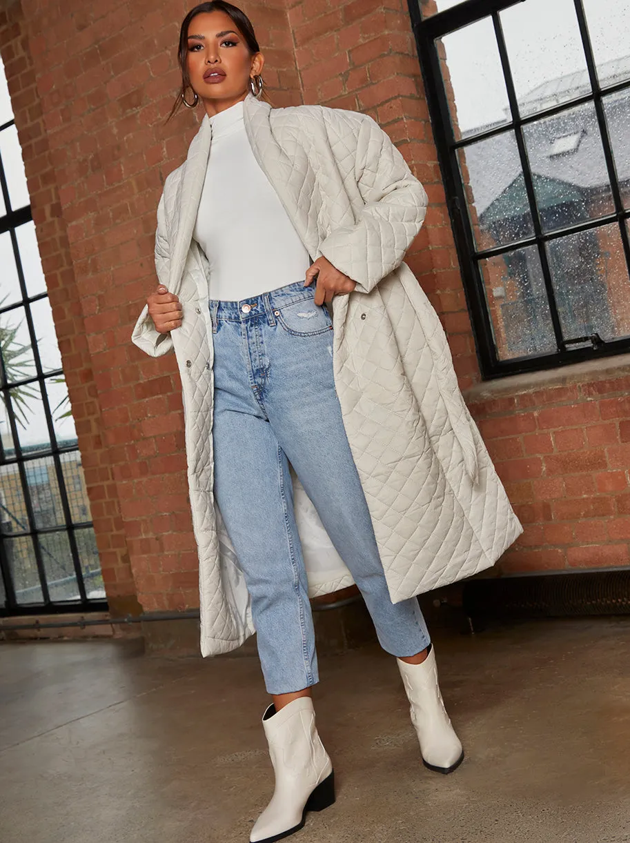 Diamond Quilted Longline Belted Coat in Cream sold by Chi Chi London
